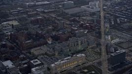 4K aerial stock footage of flying by a hospital on the West Side at sunset, Chicago, Illinois Aerial Stock Footage | AX0170_0045