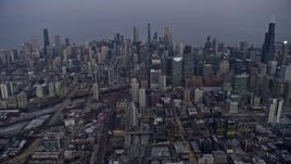4K aerial stock footage of flying high toward skyscrapers in downtown at sunset, Downtown Chicago, Illinois Aerial Stock Footage | AX0170_0046