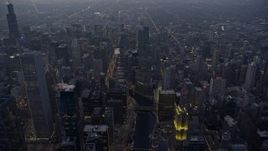 4K aerial stock footage of flying over Chicago River and Downtown Chicago skyscrapers at sunset, Chicago, Illinois Aerial Stock Footage | AX0170_0050