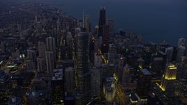 4K aerial stock footage flying past Trump Tower and Downtown Chicago skyscrapers at twilight, Illinois Aerial Stock Footage | AX0170_0053