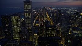4K aerial stock footage fly over Two Prudential Plaza, reveal Grant Park at twilight, Downtown Chicago, Illinois Aerial Stock Footage | AX0170_0063