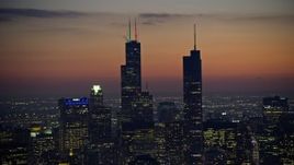 4K aerial stock footage of Willis Tower and Trump Tower with holiday lights at twilight, Downtown Chicago, Illinois Aerial Stock Footage | AX0170_0064