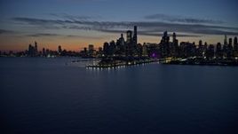 4K aerial stock footage a wide view of Navy Pier and the lakefront skyline at twilight, Downtown Chicago, Illinois Aerial Stock Footage | AX0170_0065