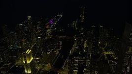 4K aerial stock footage of approaching the St. Regis Chicago, with a view of Navy Pier, at night, Downtown Chicago, Illinois Aerial Stock Footage | AX0170_0076