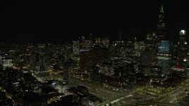 4K aerial stock footage of downtown skyscrapers seen from West Side at night, Downtown Chicago, Illinois Aerial Stock Footage | AX0170_0101