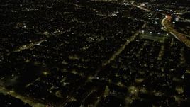 4K aerial stock footage of flying over urban neighborhoods on the West Side at night, Chicago, Illinois Aerial Stock Footage | AX0170_0102