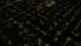 4K aerial stock footage of a bird's eye view of urban neighborhoods on the West Side at night, Chicago, Illinois Aerial Stock Footage | AX0170_0104