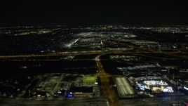4K aerial stock footage of approaching O'Hare International Airport at night, Chicago, Illinois Aerial Stock Footage | AX0170_0111