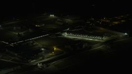 4K aerial stock footage of flying by Stateville Correctional Center prison at night, Crest Hill, Illinois Aerial Stock Footage | AX0170_0127
