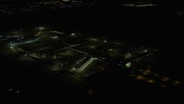 4K aerial stock footage of orbiting Stateville Correctional Center prison at night, Crest Hill, Illinois Aerial Stock Footage | AX0170_0128