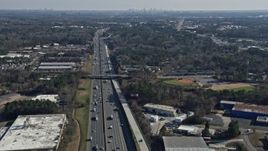 6.7K aerial stock footage tilt from Interstate 75 traffic to reveal the Atlanta skyline, Marietta, Georgia Aerial Stock Footage | AX0171_0001