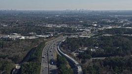 6.7K aerial stock footage tilt from Interstate 75 to reveal the distant Atlanta skyline, Marietta, Georgia Aerial Stock Footage | AX0171_0002