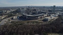 6.7K aerial stock footage fly over the Truist Park baseball stadium toward office buildings and Atlanta skyline, Georgia Aerial Stock Footage | AX0171_0012