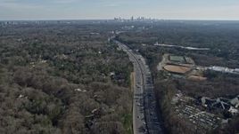 6.7K aerial stock footage of the distant Atlanta skyline seen from Interstate 75 and suburbs, Georgia Aerial Stock Footage | AX0171_0017