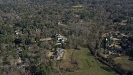 6.7K aerial stock footage tilt from Buckhead in the background to a mansion with a pool, Atlanta, Georgia Aerial Stock Footage | AX0171_0019