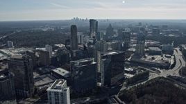6.7K aerial stock footage of Buckhead office buildings and skyscrapers, Atlanta skyline visible in distance, Georgia Aerial Stock Footage | AX0171_0027