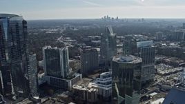 6.7K aerial stock footage of Buckhead office buildings with Atlanta skyline visible in distance, Georgia Aerial Stock Footage | AX0171_0028