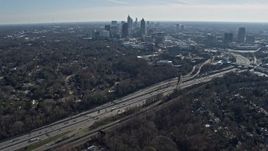 6.7K aerial stock footage tilt from warehouse buildings to reveal Midtown Atlanta skyline, Georgia Aerial Stock Footage | AX0171_0035