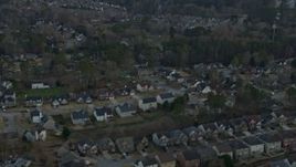 6.7K aerial stock footage of flying by suburban homes at sunset, Lawrenceville, Georgia Aerial Stock Footage | AX0171_0136