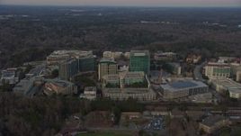 6.7K aerial stock footage of flying by the Centers for Disease Control and Prevention at sunset, Atlanta, Georgia Aerial Stock Footage | AX0171_0144