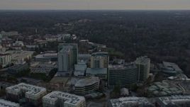 6.7K aerial stock footage orbit the Centers for Disease Control and Prevention at sunset, reveal Atlanta skyline, Georgia Aerial Stock Footage | AX0171_0147