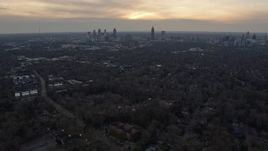 6.7K aerial stock footage of tilting from Downtown and Midtown to urban homes at sunset, Atlanta, Georgia Aerial Stock Footage | AX0171_0151