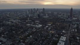 6.7K aerial stock footage of tilting from office and apartment buildings to reveal Downtown Atlanta at sunset, Georgia Aerial Stock Footage | AX0171_0154