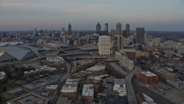 6.7K aerial stock footage orbit the Downtown Atlanta skyline at sunset and reveal stadium, Georgia Aerial Stock Footage | AX0171_0161