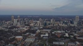 6.7K aerial stock footage of flying past skyscrapers in Midtown Atlanta at sunset, Georgia Aerial Stock Footage | AX0171_0166