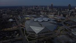6.7K aerial stock footage of circling Mercedes-Benz Stadium at sunset in Downtown Atlanta, Georgia Aerial Stock Footage | AX0171_0195