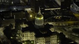 6.7K aerial stock footage of flying away from the Georgia State Capitol Building at night in Downtown Atlanta, Georgia Aerial Stock Footage | AX0171_0206