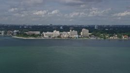 6.7K aerial stock footage of approaching a waterfront hospital in Miami, Florida Aerial Stock Footage | AX0172_003