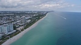 6.7K aerial stock footage of flying by hotels and oceanfront condos to reveal beaches in Miami Beach, Florida Aerial Stock Footage | AX0172_025