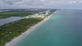 6.7K aerial stock footage of following the beach toward coastal homes in Hollywood, Florida Aerial Stock Footage | AX0172_037