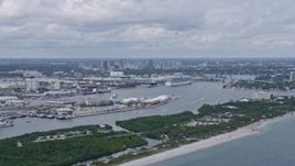 6.7K aerial stock footage of Downtown Fort Lauderdale, Florida behind cruise ships at Port Everglades Aerial Stock Footage | AX0172_041