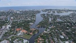 6.7K aerial stock footage tilt from yachts on New River in Downtown Fort Lauderdale, Florida, reveal coastal neighborhoods Aerial Stock Footage | AX0172_059
