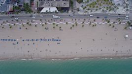 6.7K aerial stock footage of a bird's eye view of sunbathers on the beach in Fort Lauderdale, Florida Aerial Stock Footage | AX0172_063