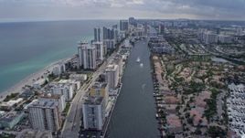6.7K aerial stock footage tilt from canal to reveal and pass condos in Hollywood, Florida Aerial Stock Footage | AX0172_070