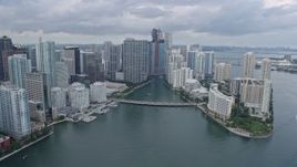 6.7K aerial stock footage fly over Brickell Key, pan to reveal Miami River in Downtown Miami, Florida Aerial Stock Footage | AX0172_086