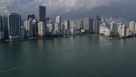 6.7K aerial stock footage tilt from the bay to reveal waterfront skyscrapers in Downtown Miami, Florida Aerial Stock Footage | AX0172_121