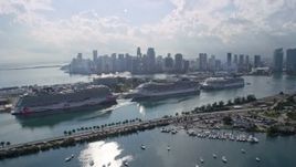6.7K aerial stock footage of cruise ships at the port and the skyline of Downtown Miami, Florida Aerial Stock Footage | AX0172_123