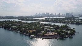 6.7K aerial stock footage of flying by waterfront mansions on islands in Miami, Florida Aerial Stock Footage | AX0172_125
