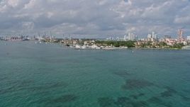 6.7K aerial stock footage of approaching Fisher Island's oceanfront condo complexes, Miami, Florida Aerial Stock Footage | AX0172_128