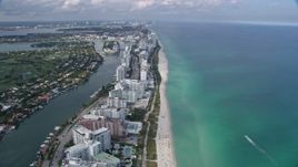 6.7K aerial stock footage tilt from the beach for a wide view of Miami Beach, Florida Aerial Stock Footage | AX0172_137