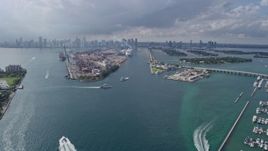 6.7K aerial stock footage of tilting from Government Cut to reveal and approach Port of Miami, Florida Aerial Stock Footage | AX0172_145