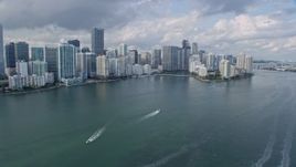 6.7K aerial stock footage tilt from the bay to Downtown Miami skyscrapers and Brickell Key in Florida Aerial Stock Footage | AX0172_152