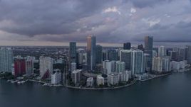 6.7K aerial stock footage of flying by Downtown Miami skyscrapers overlooking the bay, Florida at sunset Aerial Stock Footage | AX0172_170