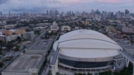 6.7K aerial stock footage flyby stadium in Little Havana and reveal downtown skyline at sunset, Miami, Florida Aerial Stock Footage | AX0172_181