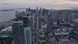 6.7K aerial stock footage tilt from Downtown Miami streets to reveal and approach skyscrapers at sunset, Miami, Florida Aerial Stock Footage | AX0172_184
