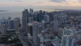 6.7K aerial stock footage of flying past Downtown Miami skyscrapers at sunset, Miami, Florida Aerial Stock Footage | AX0172_185